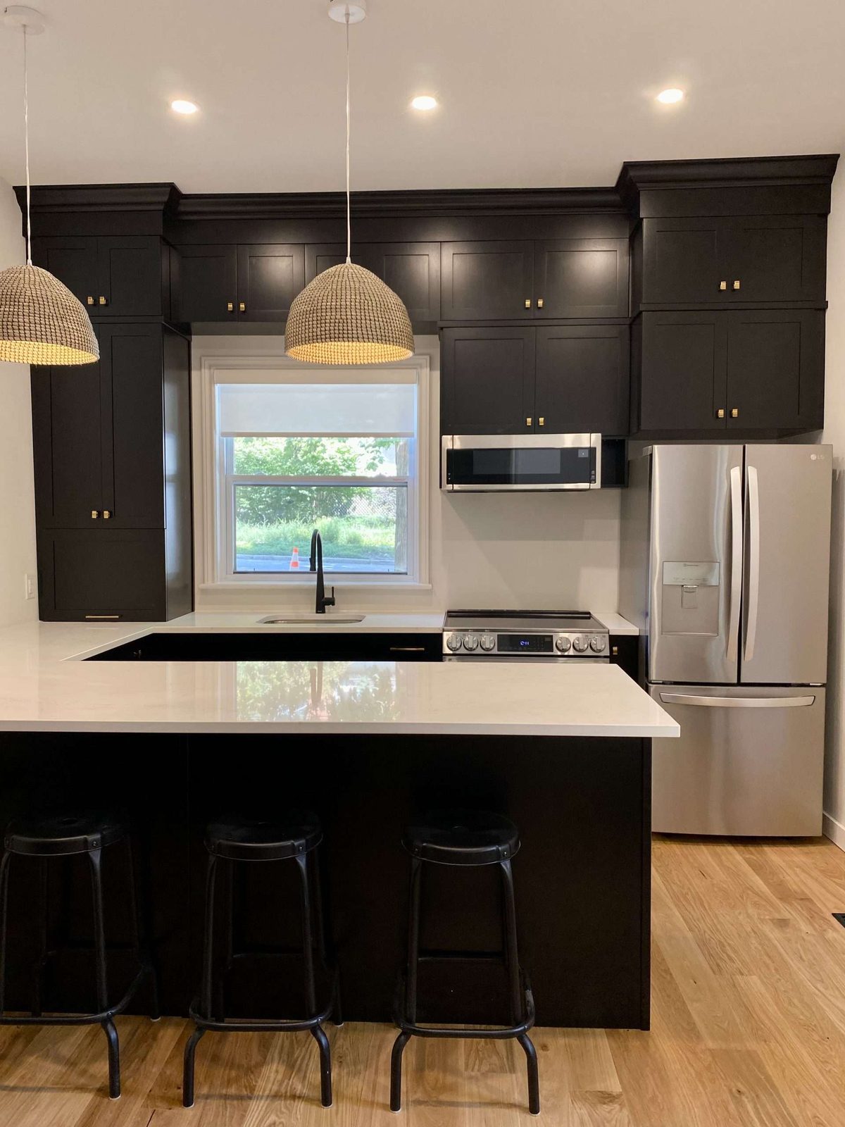Dark modern kitchen with island seating
