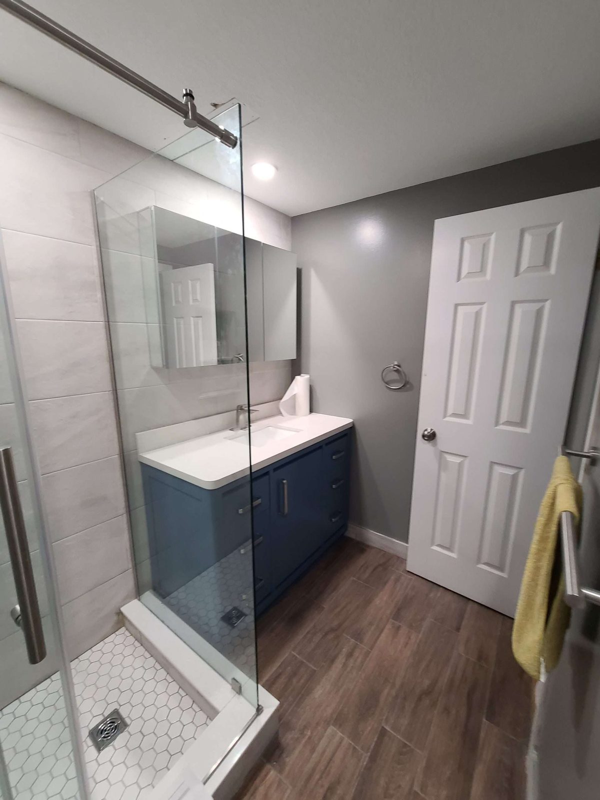 Walk-in shower with a barn door