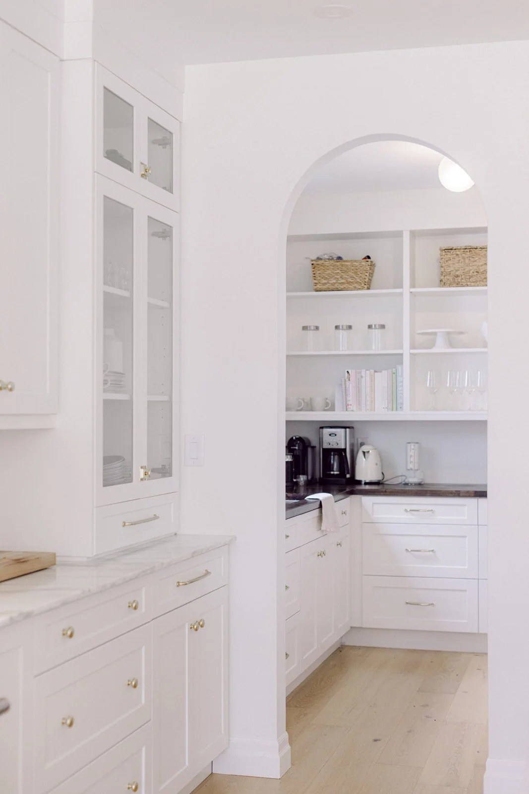 White and wood kitchen with stainless appliances